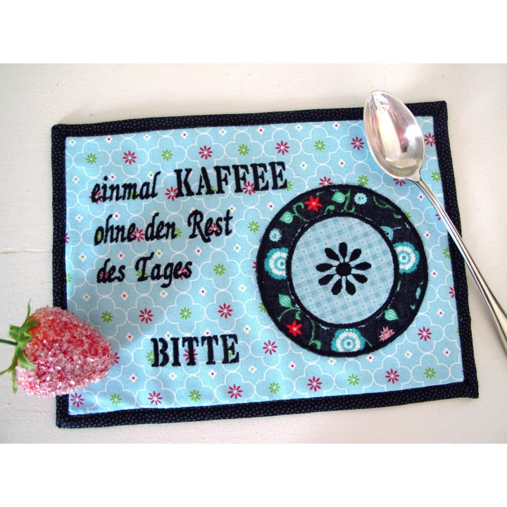 MugRug ein Untersetzer für die Kaffeetasse in türkis schwarz