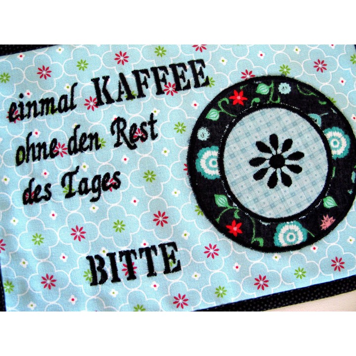 MugRug ein Untersetzer für die Kaffeetasse in türkis schwarz